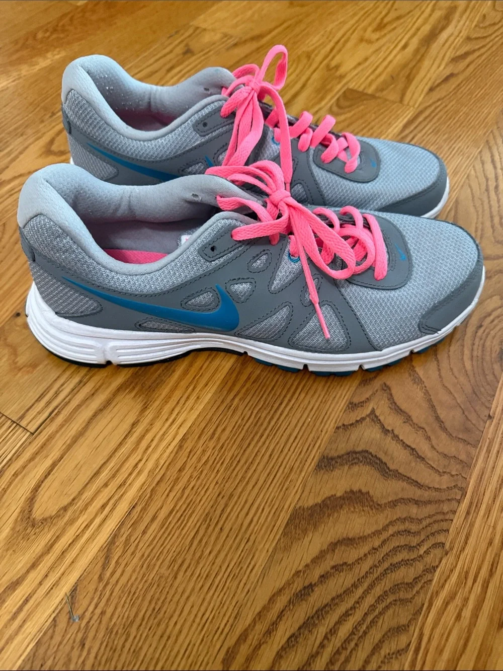 Nike Women's Gray Athletic Sneakers with Pink Laces and Blue Swoosh
